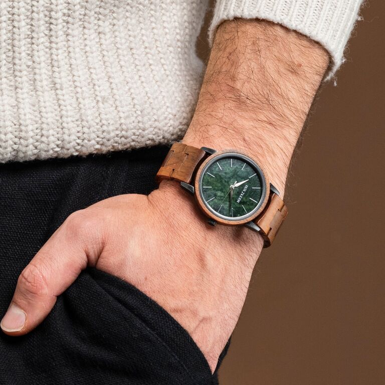 "Bob" watch, featuring a koa wood frame and marble dial, exuding a natural and elegant style.
A man wearing "Bob" watch.